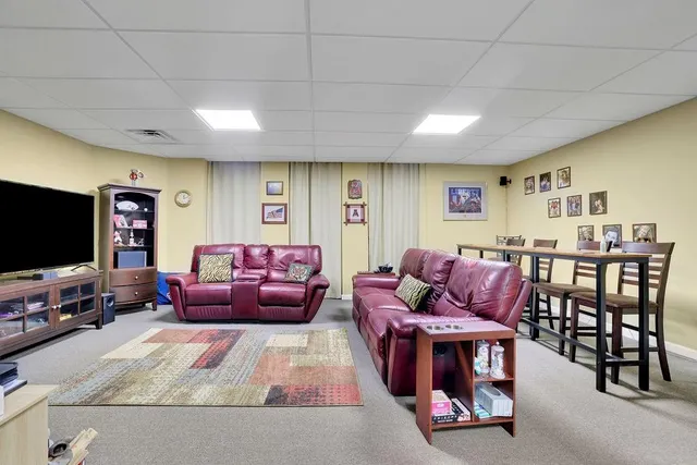 a view of a patio with table and chairs and wooden floor