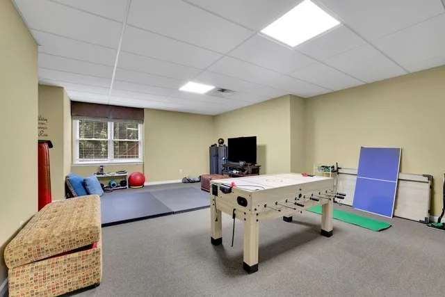 a view of a patio with a table and chairs