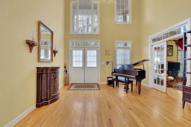 a view of a dining room with furniture and chandelier