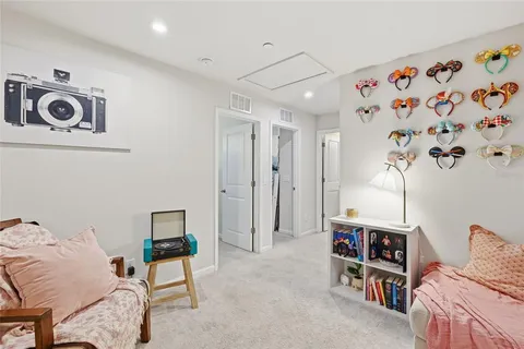 a bedroom with bed and window