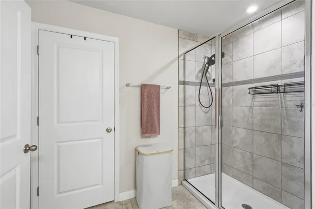 a view of walk in closet with clothes