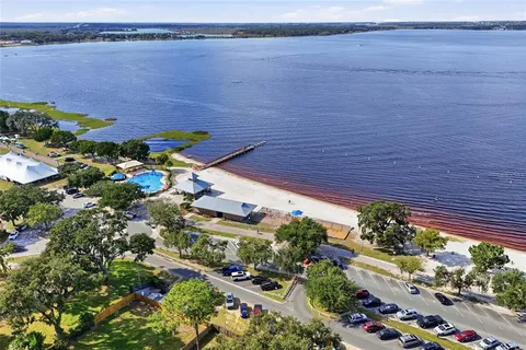 an aerial view of a house with a lake view