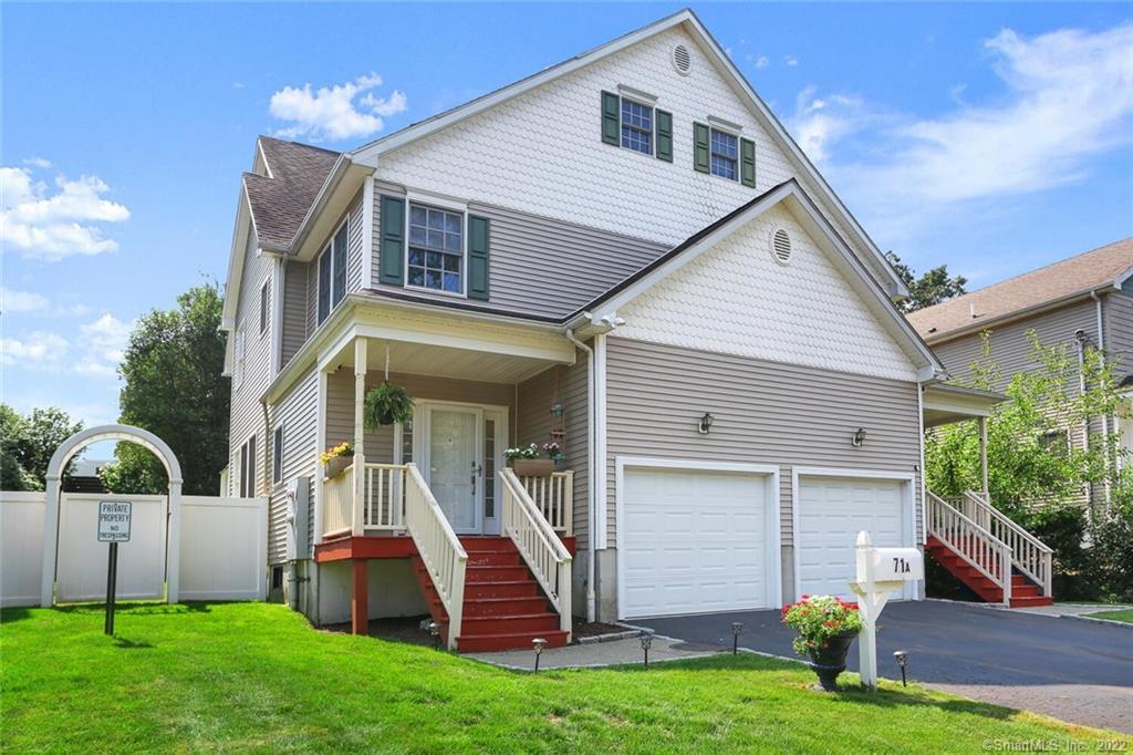 71 Richland Road, Unit A Greenwich, CT 06830 - Photo 1 of 1 a view of a house with a yard