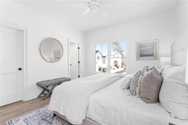 a bathroom with a granite countertop toilet sink and mirror