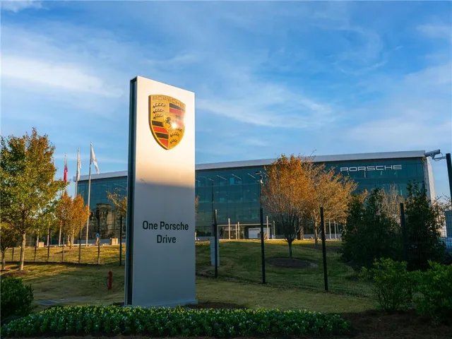 a view of street with cars parked in front of it
