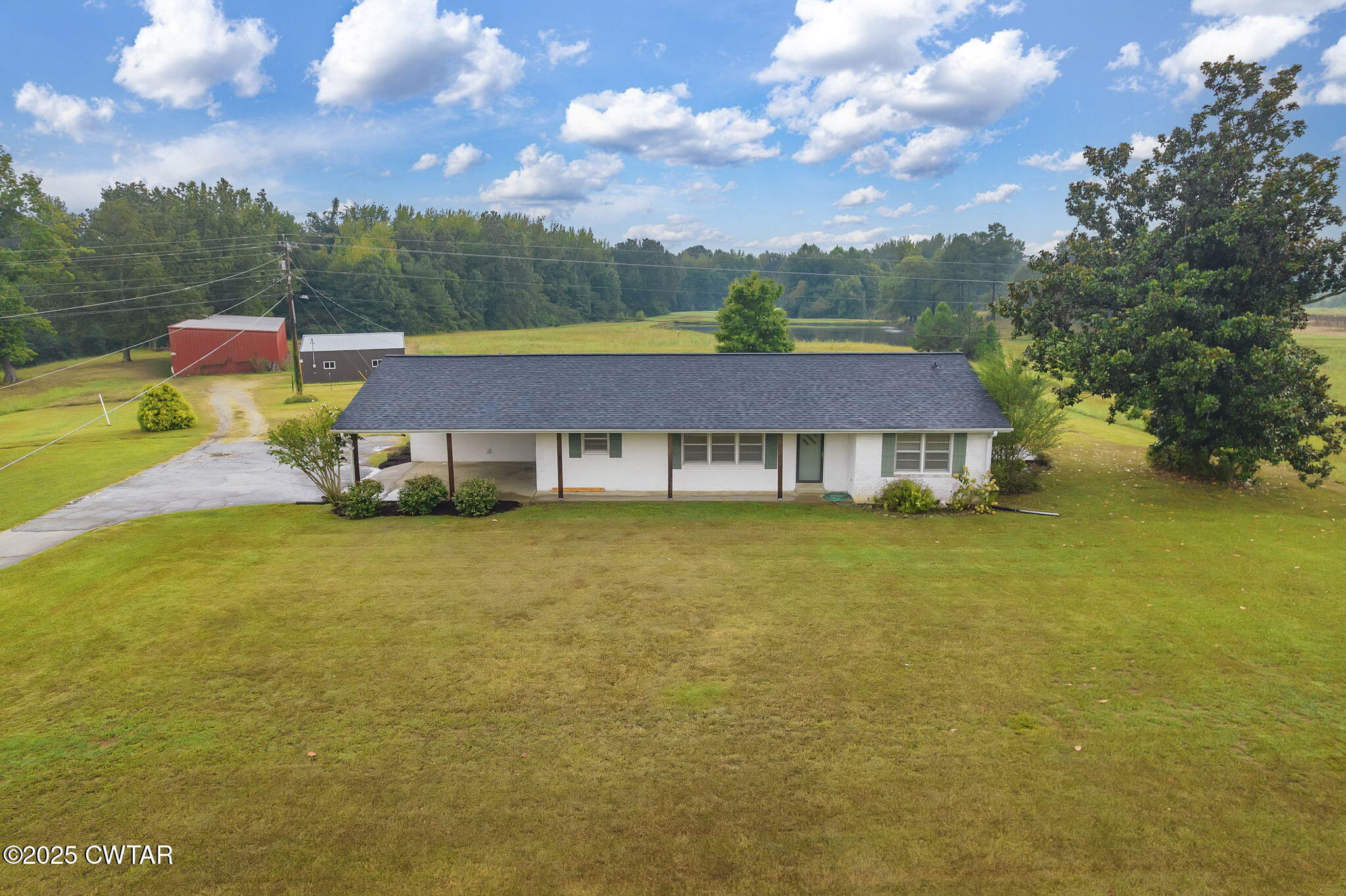 a view of a house with a big yard