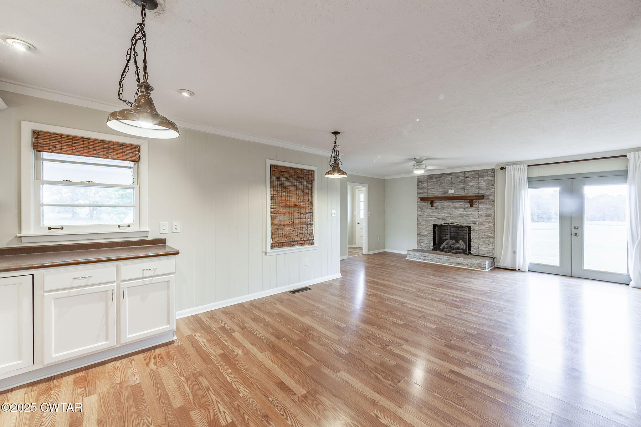 3810 Beech Bluff Road Jackson, TN 38301 - Photo 12 of 24 a view of empty room with wooden floor and fireplace