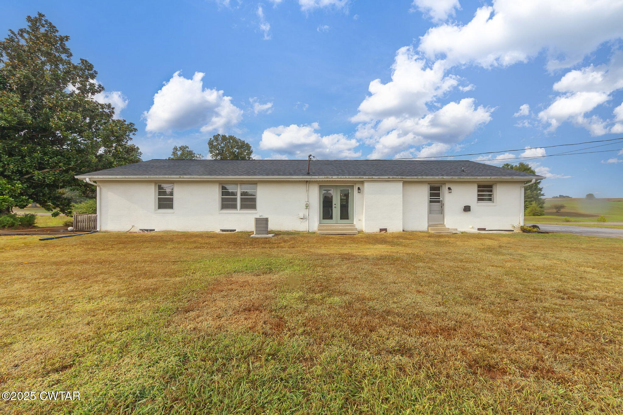 3810 Beech Bluff Road Jackson, TN 38301 - Photo 19 of 24 a view of a house with a backyard and a tree