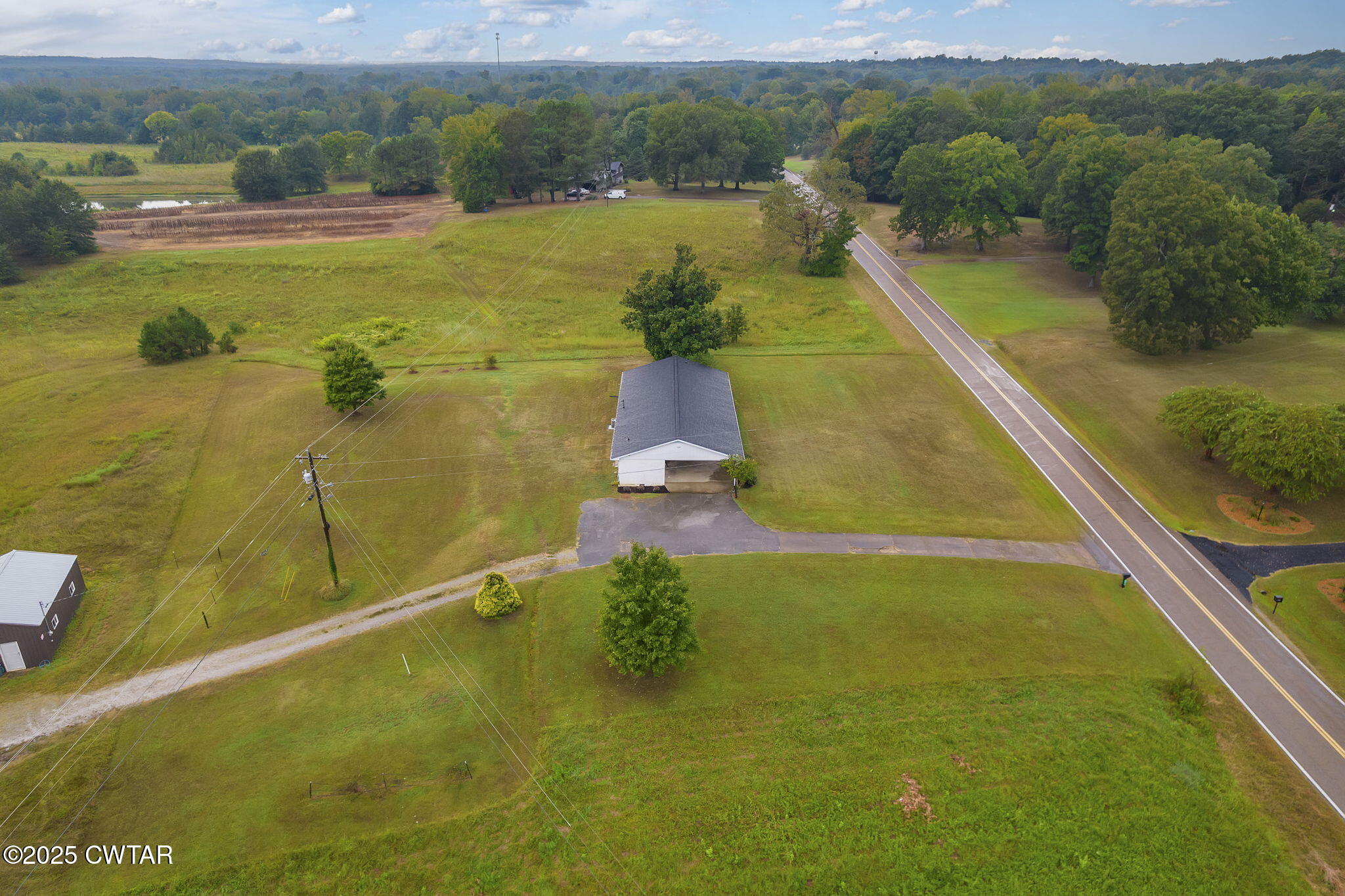 3810 Beech Bluff Road Jackson, TN 38301 - Photo 21 of 24 a view of a swimming pool and lake view