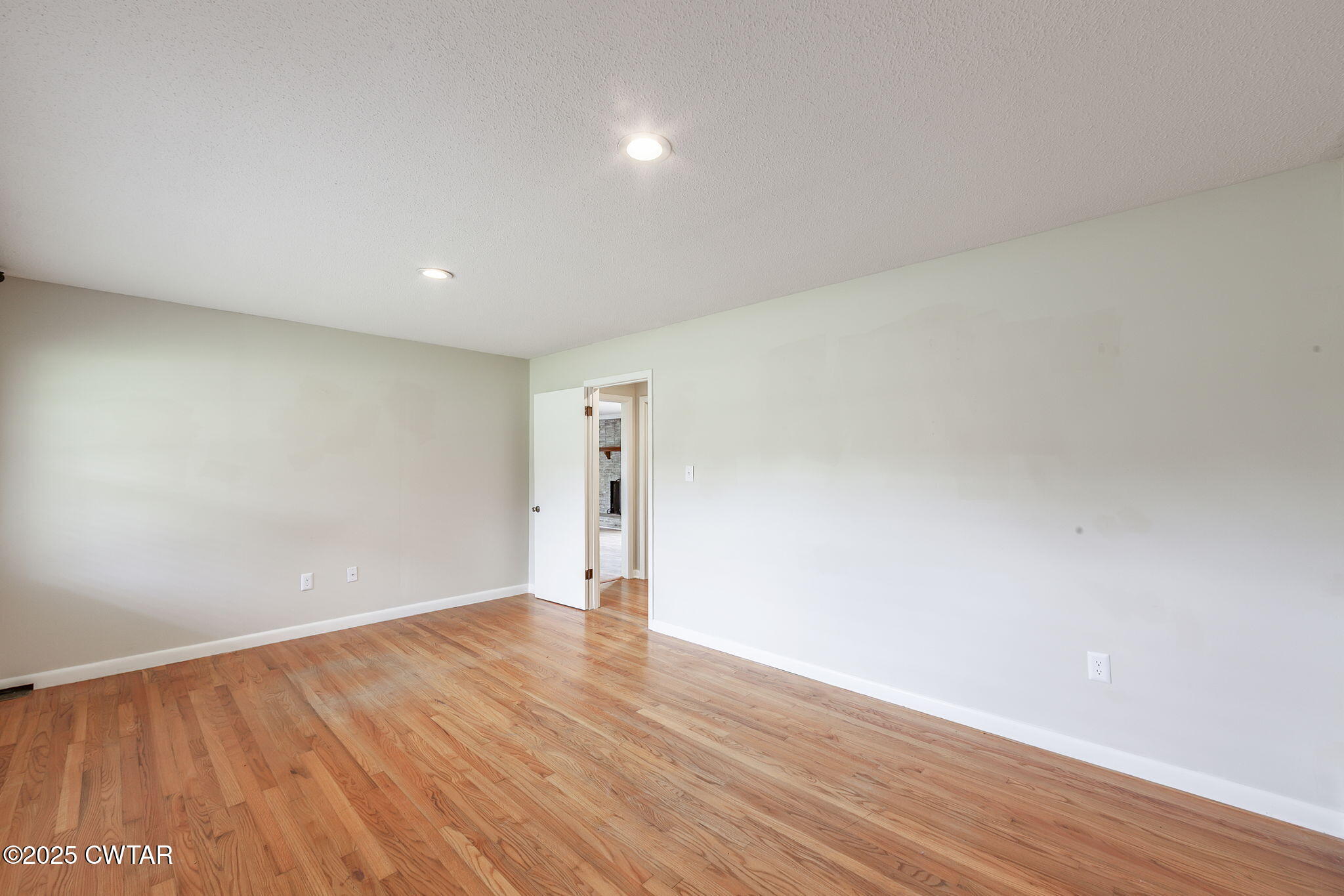 3810 Beech Bluff Road Jackson, TN 38301 - Photo 5 of 24 a view of an empty room with wooden floor