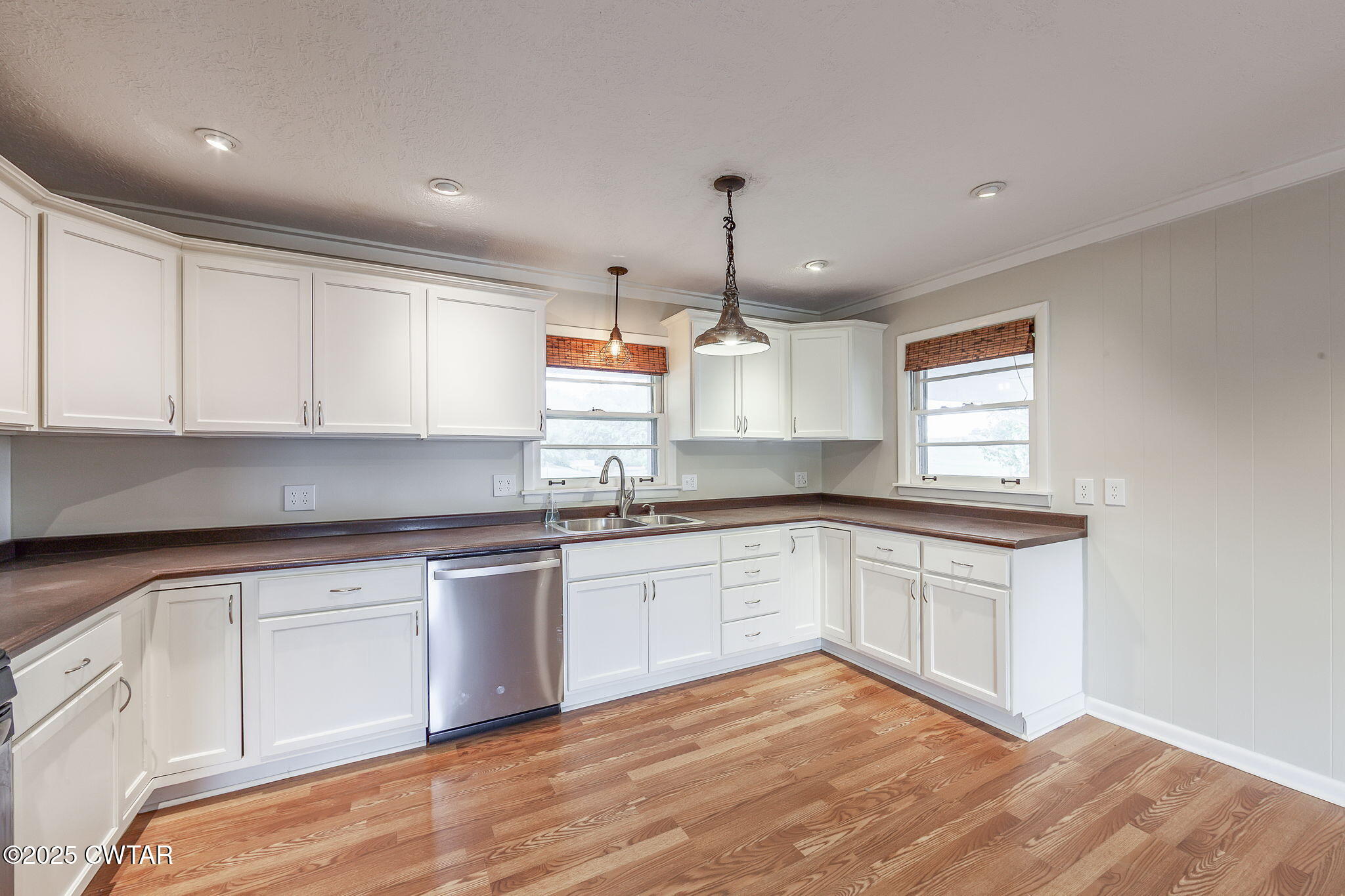 3810 Beech Bluff Road Jackson, TN 38301 - Photo 7 of 24 a kitchen with granite countertop white cabinets and white appliances
