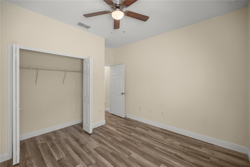 13745 Southwest 43rd Circle Ocala, FL 34473 - Photo 17 of 25 wooden floor in an empty room