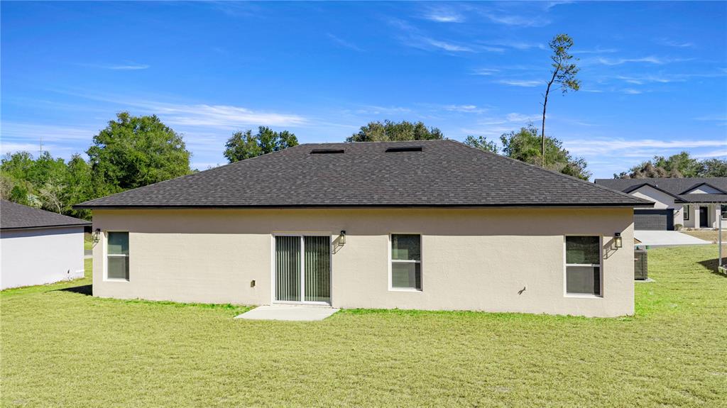 13745 Southwest 43rd Circle Ocala, FL 34473 - Photo 23 of 25 a house that has a tree in it