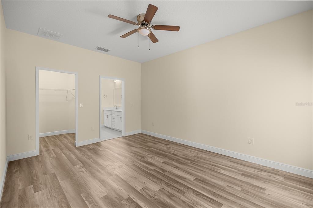 13745 Southwest 43rd Circle Ocala, FL 34473 - Photo 10 of 25 wooden floor in an empty room