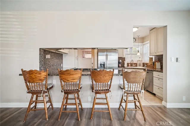 a dining room with furniture and wooden floor