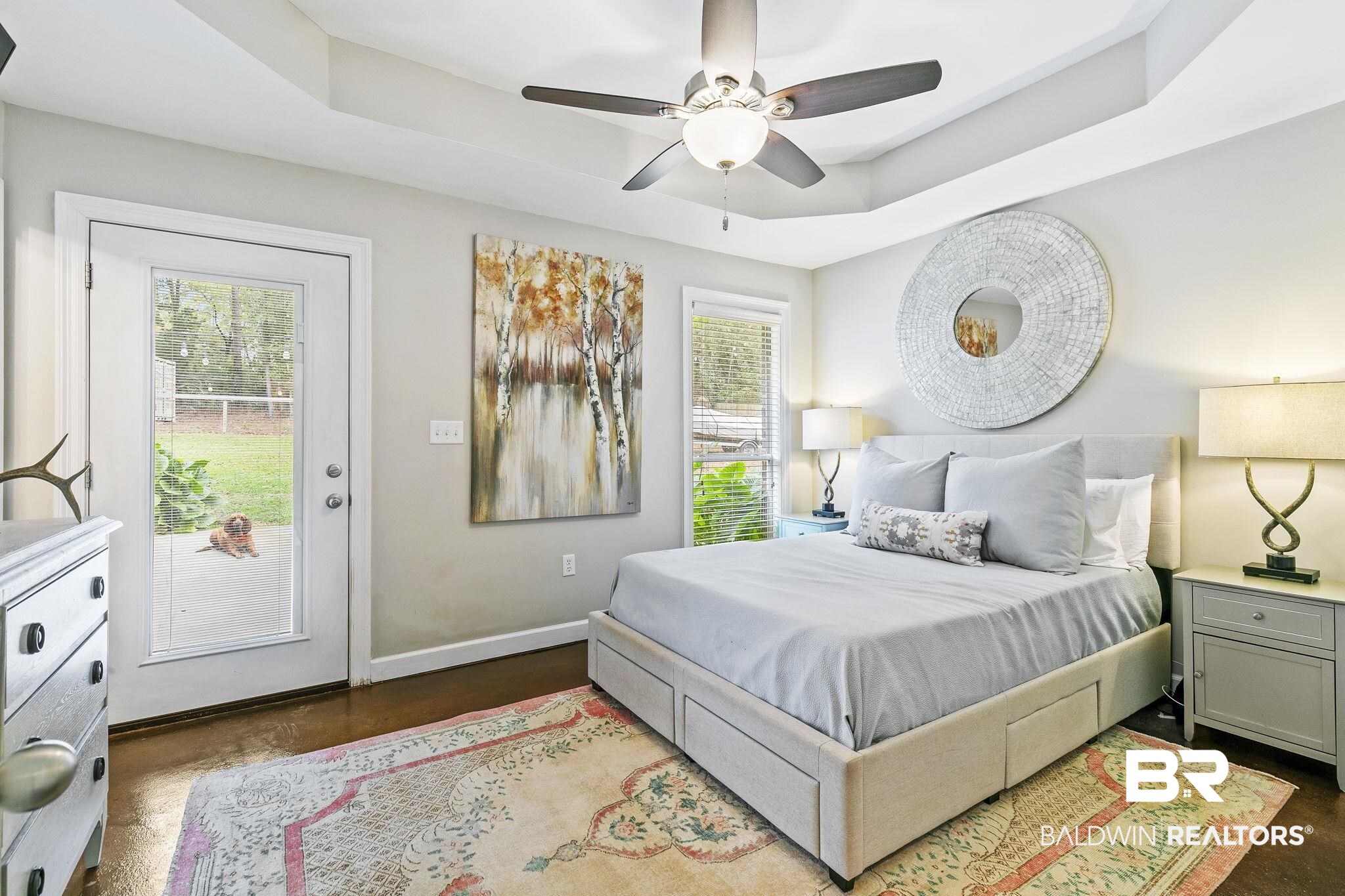 32072 Buzbee Road Daphne, AL 36527 - Photo 16 of 41 Bedroom with access to exterior, ceiling fan, a raised ceiling, and dark wood-type flooring
