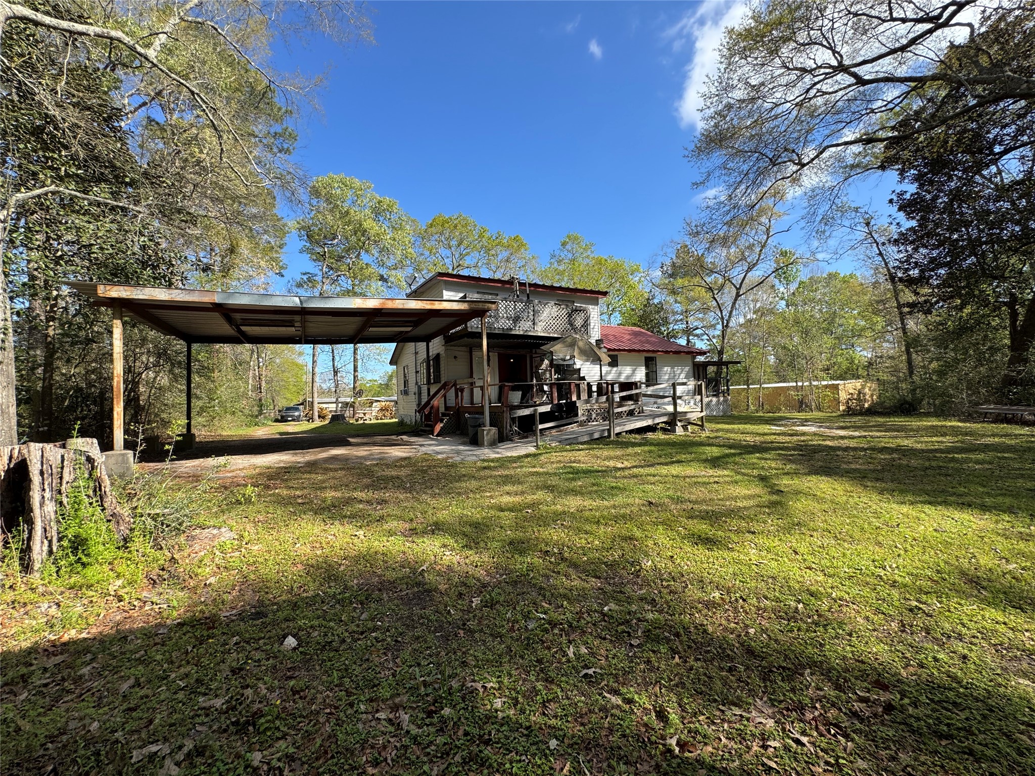 41 Joyce Street Shepherd, TX 77371 - Photo 18 of 18 View from backyard. Large covered carport