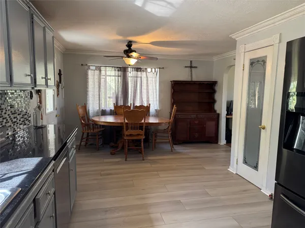 a view of a livingroom with furniture and window