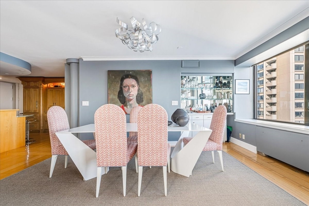 65 East India Row, Unit 26F Boston, MA 02110 - Photo 12 of 27 a view of a dining room with furniture window and outside view