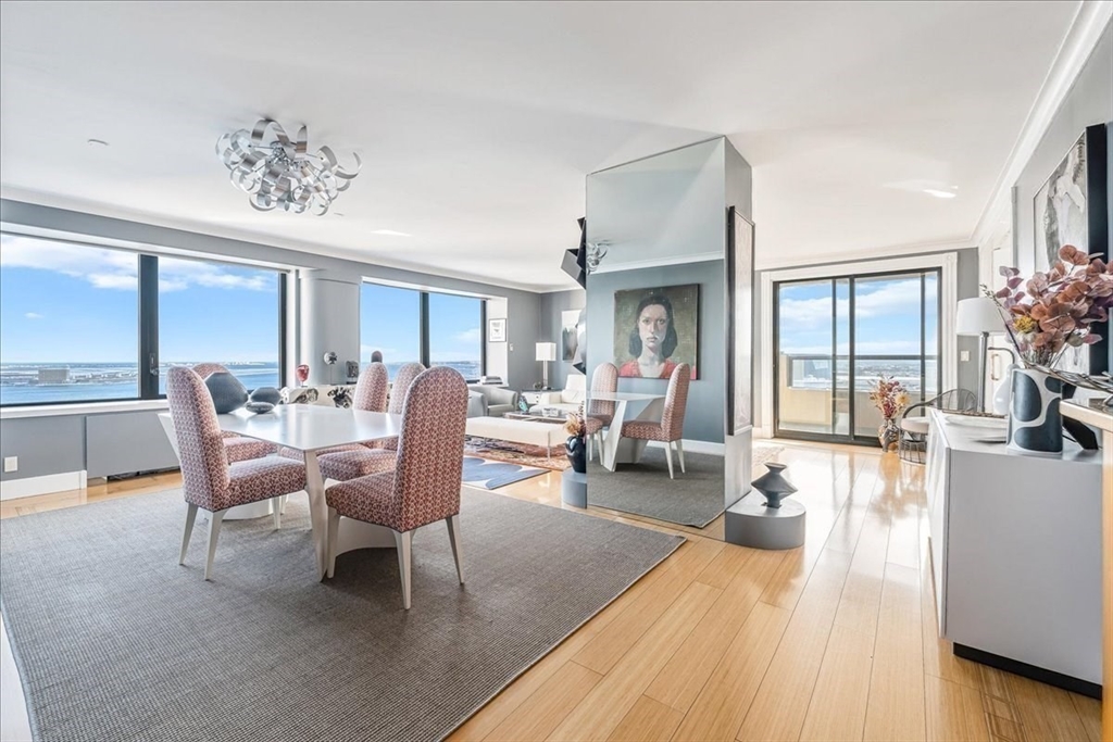 65 East India Row, Unit 26F Boston, MA 02110 - Photo 8 of 27 a living room with furniture dining area and a large window
