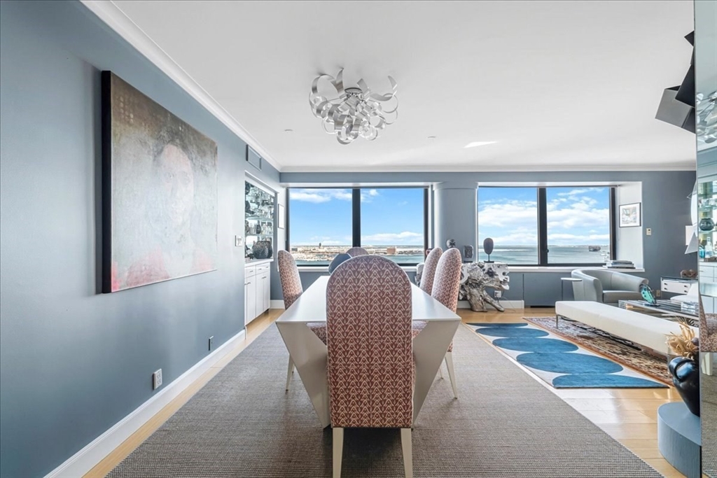 65 East India Row, Unit 26F Boston, MA 02110 - Photo 9 of 27 a living room with furniture rug and window
