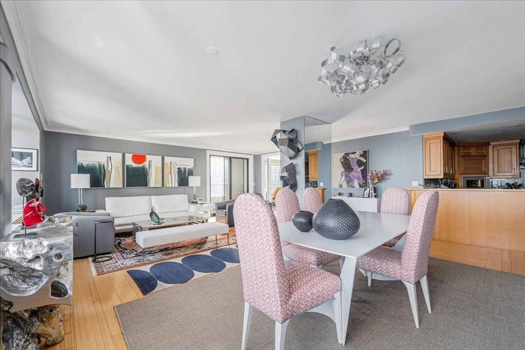 65 East India Row, Unit 26F Boston, MA 02110 - Photo 10 of 27 a living room with furniture and a potted plant