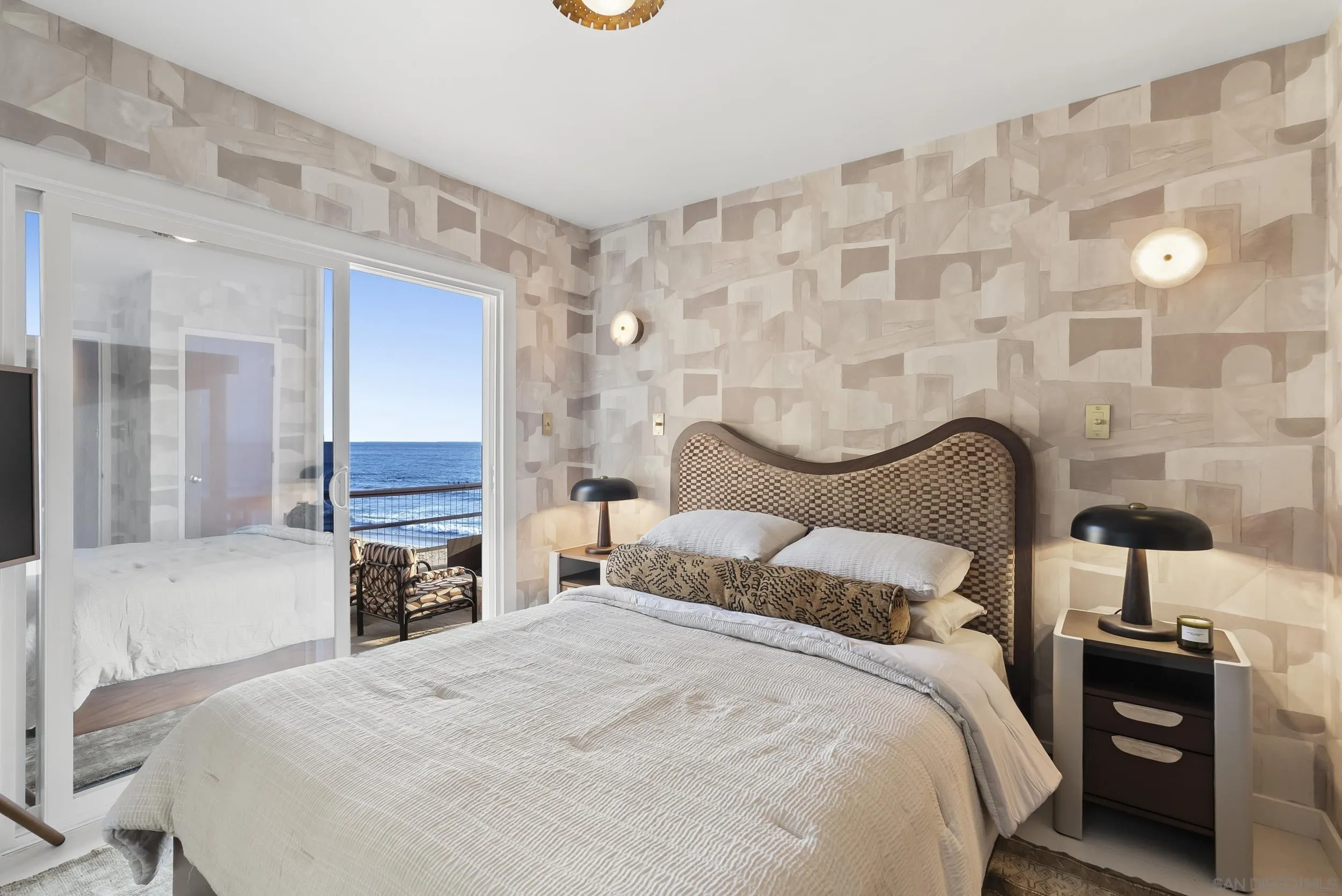 430 Moonlight Lane Encinitas, CA 92024 - Photo 11 of 28 a bedroom with a bed and a lamp