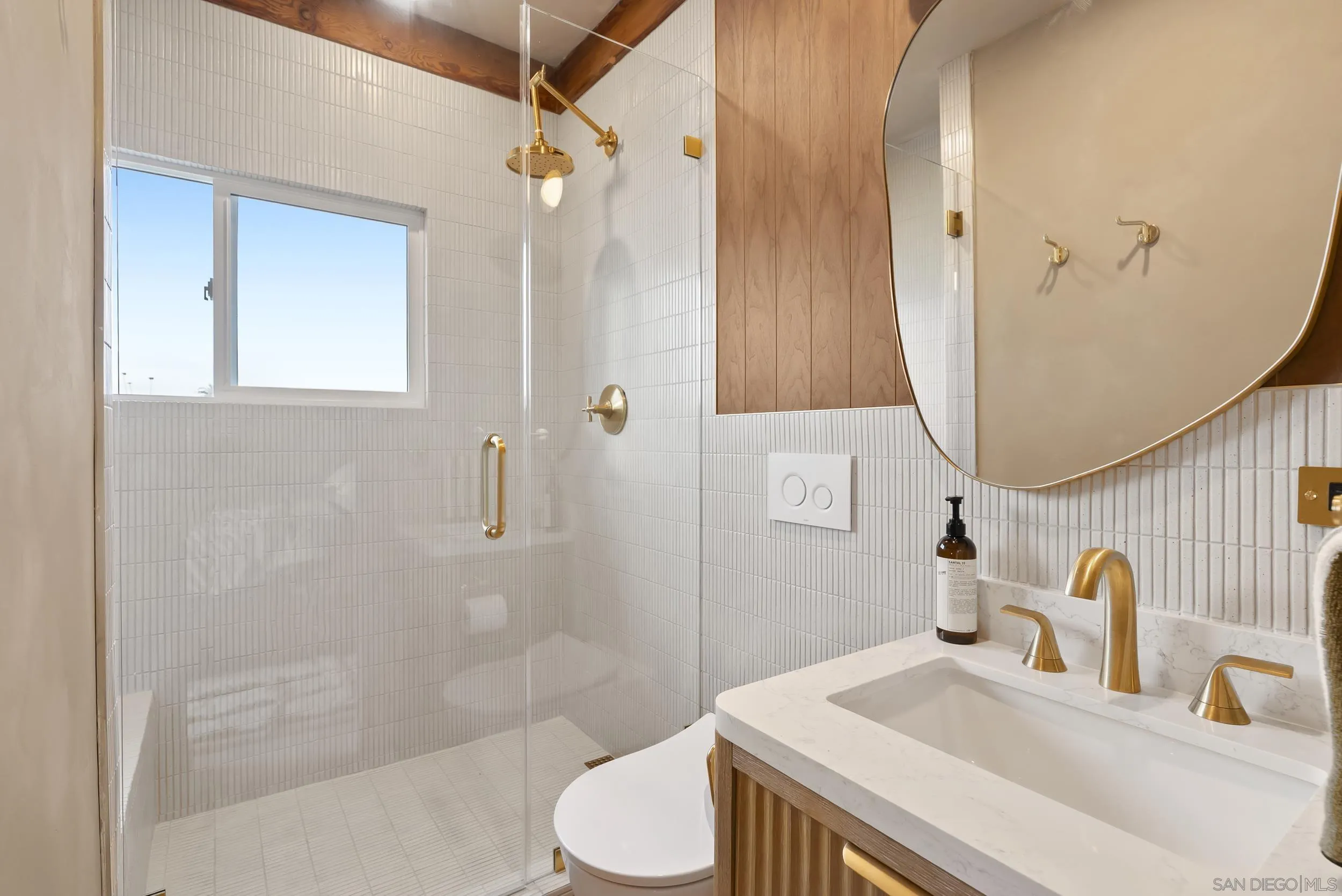 430 Moonlight Lane Encinitas, CA 92024 - Photo 16 of 28 a bathroom with a sink toilet and shower