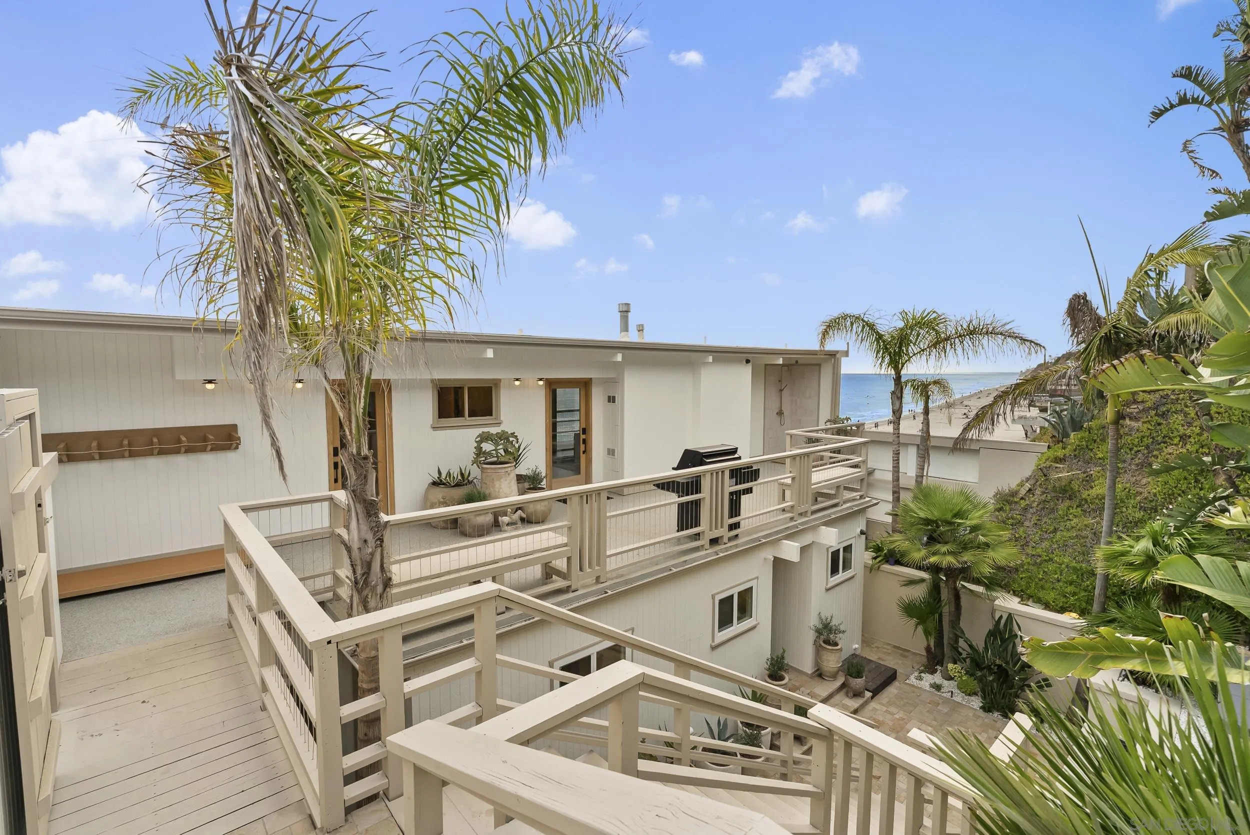 430 Moonlight Lane Encinitas, CA 92024 - Photo 24 of 28 a view of a patio with table and chairs and potted plants