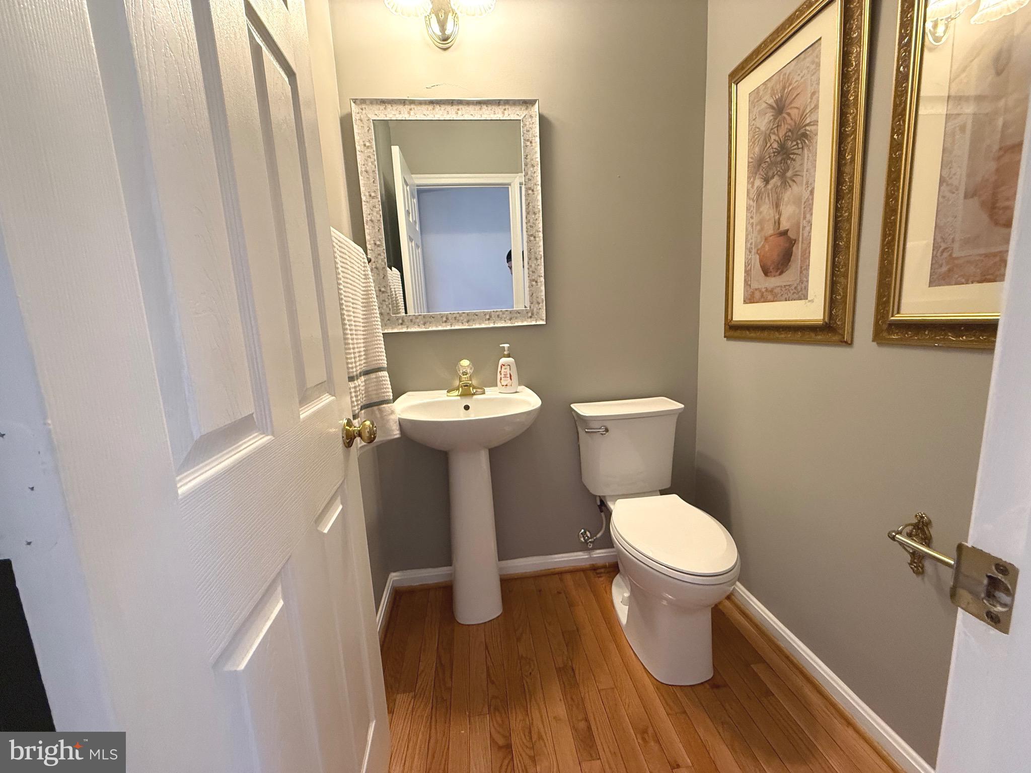 1743 Wheyfield Drive Frederick, MD 21701 - Photo 14 of 47 a bathroom with a toilet sink and mirror