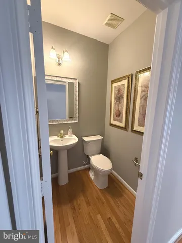 a view of staircase with white walls and a window