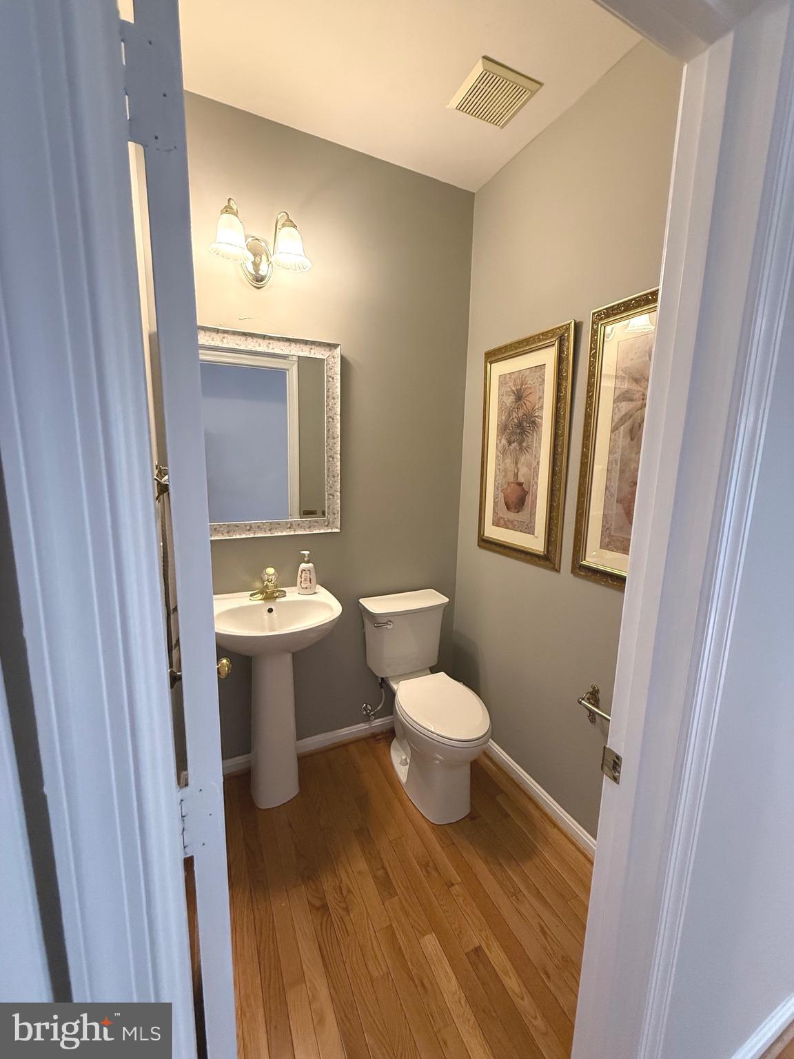 1743 Wheyfield Drive Frederick, MD 21701 - Photo 15 of 47 a bathroom with a toilet sink and a mirror