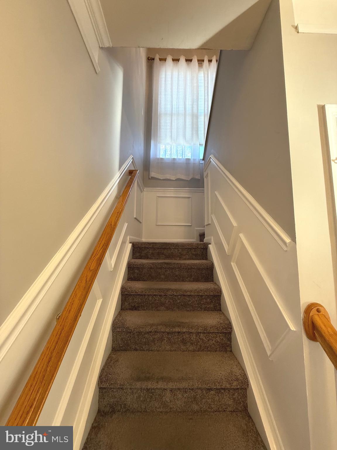 1743 Wheyfield Drive Frederick, MD 21701 - Photo 16 of 47 a view of staircase with white walls and a window