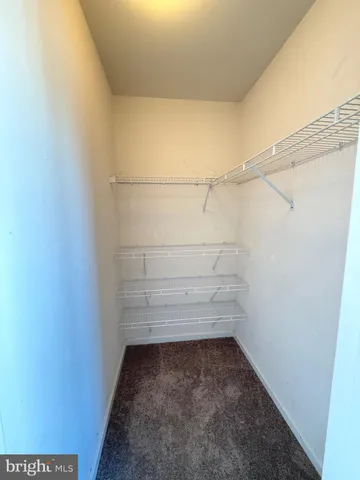 an empty room with an empty space and wooden door