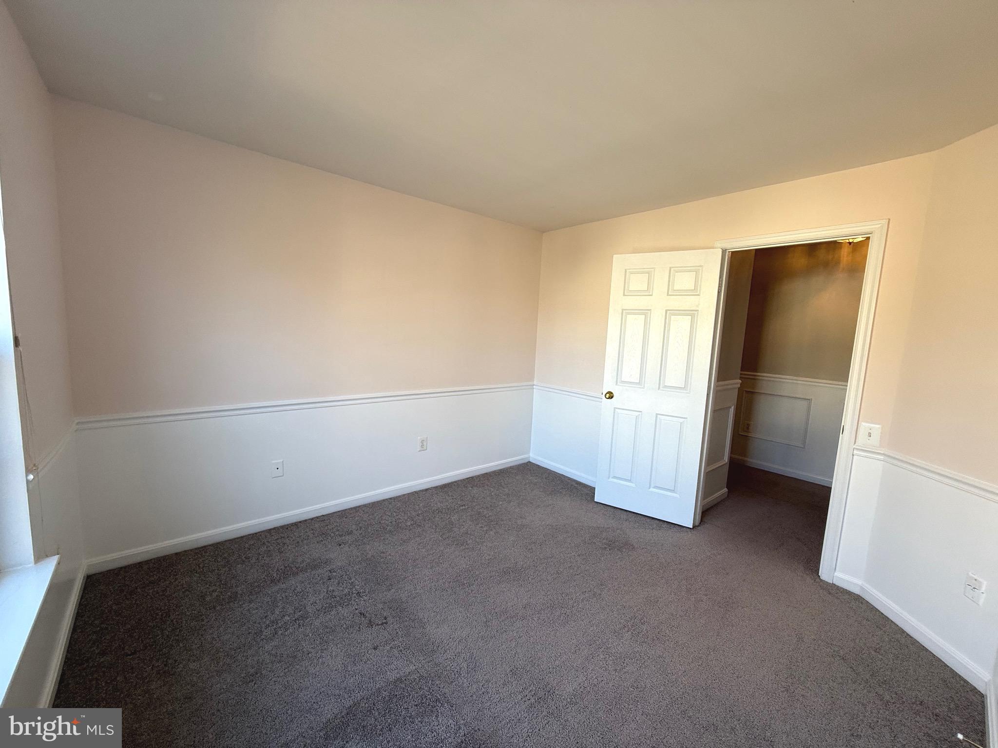 1743 Wheyfield Drive Frederick, MD 21701 - Photo 29 of 47 an empty room with an empty space and wooden door