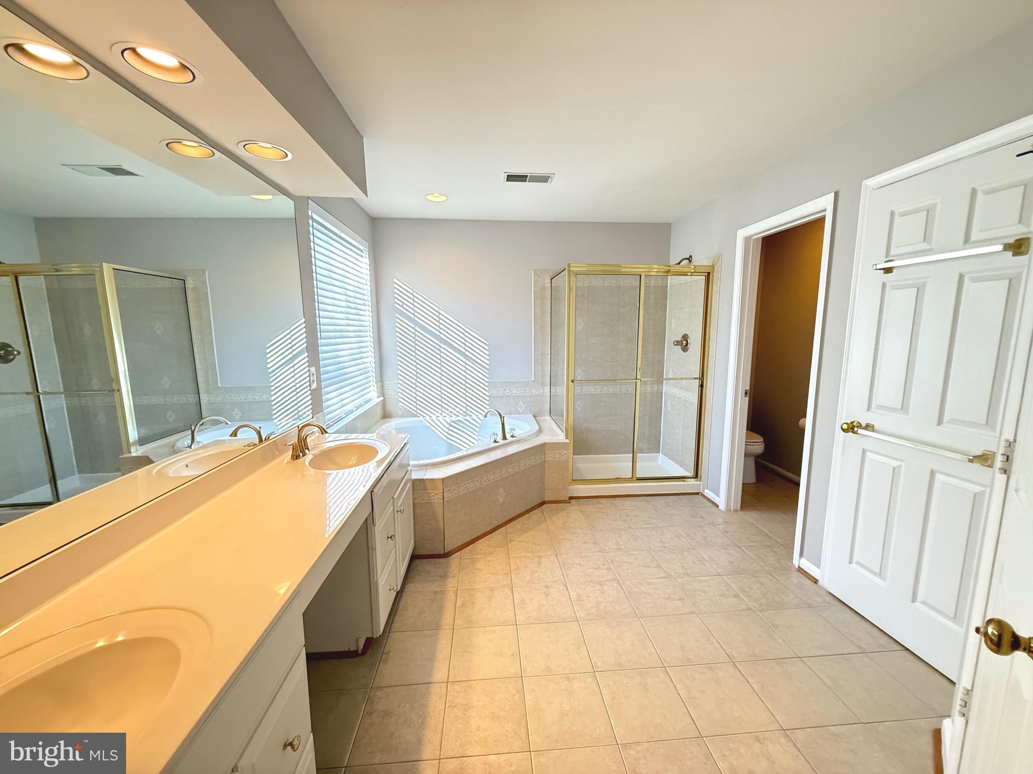 1743 Wheyfield Drive Frederick, MD 21701 - Photo 37 of 47 a spacious bathroom with a tub and shower