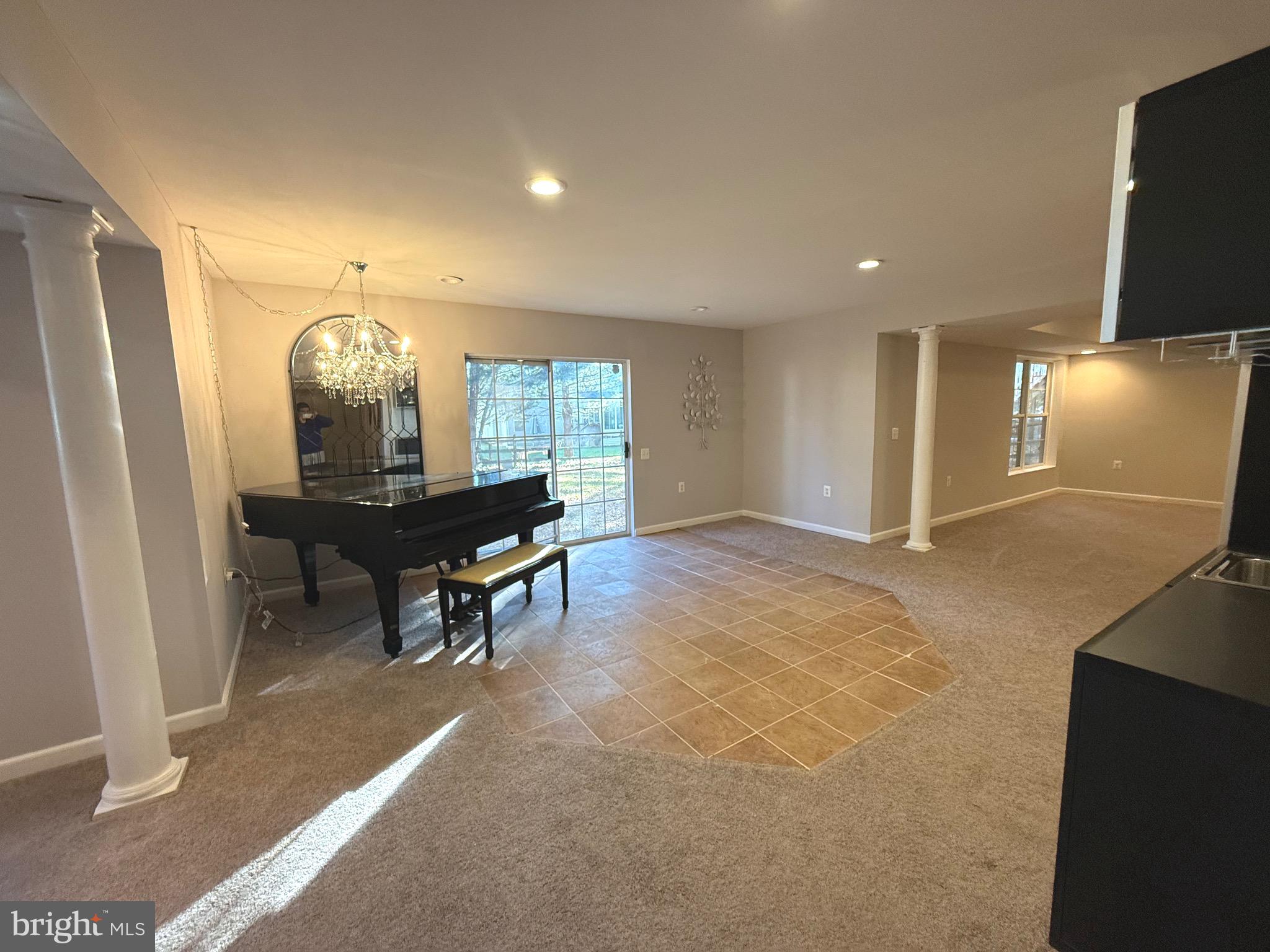 1743 Wheyfield Drive Frederick, MD 21701 - Photo 43 of 47 a living room with furniture a window and a flat screen tv