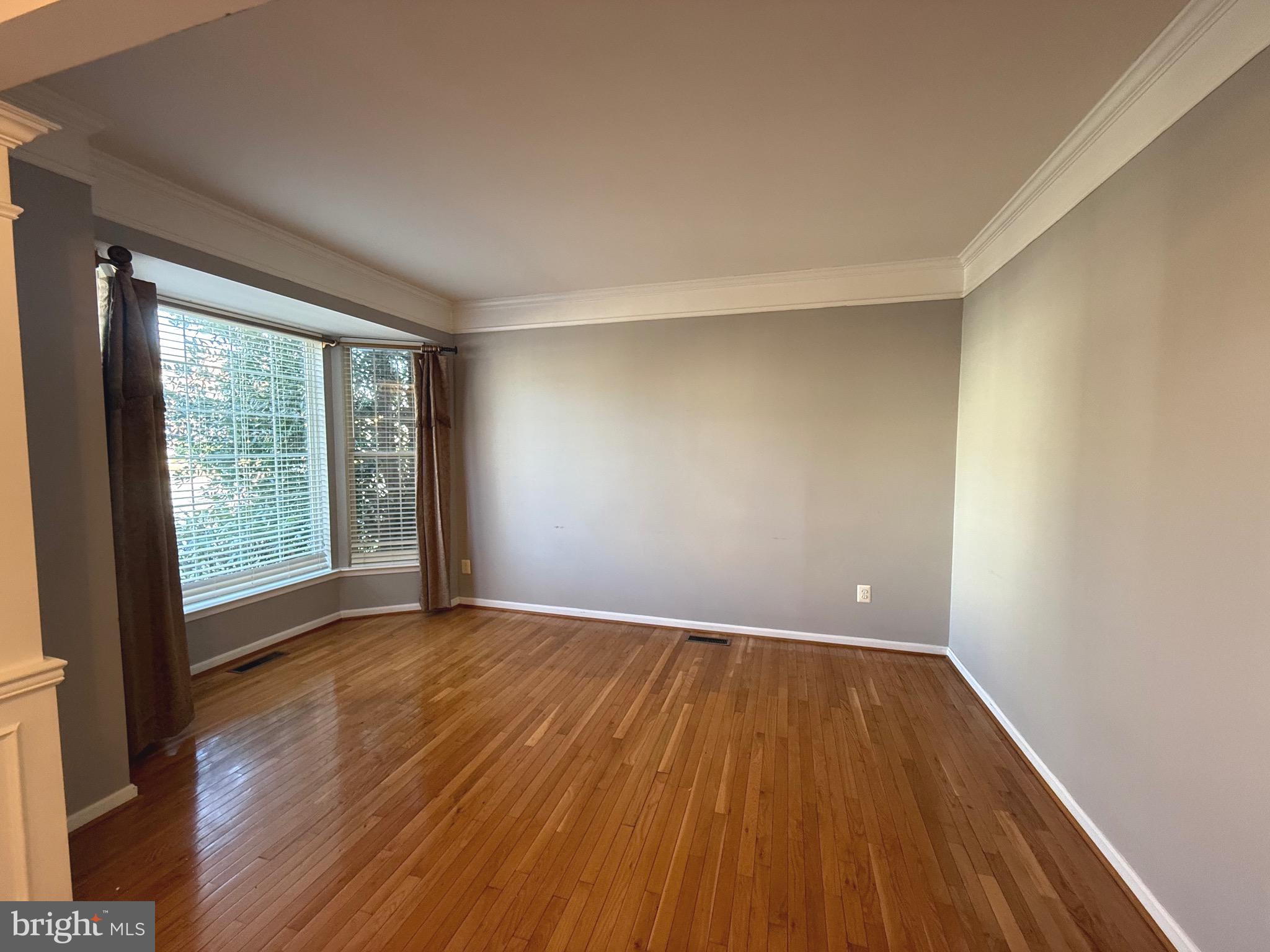 1743 Wheyfield Drive Frederick, MD 21701 - Photo 5 of 47 wooden floor in an empty room with a window