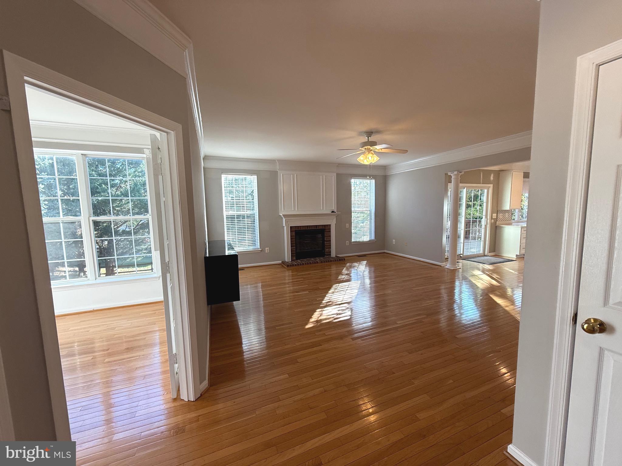 1743 Wheyfield Drive Frederick, MD 21701 - Photo 6 of 47 a view of empty room with wooden floor and fireplace
