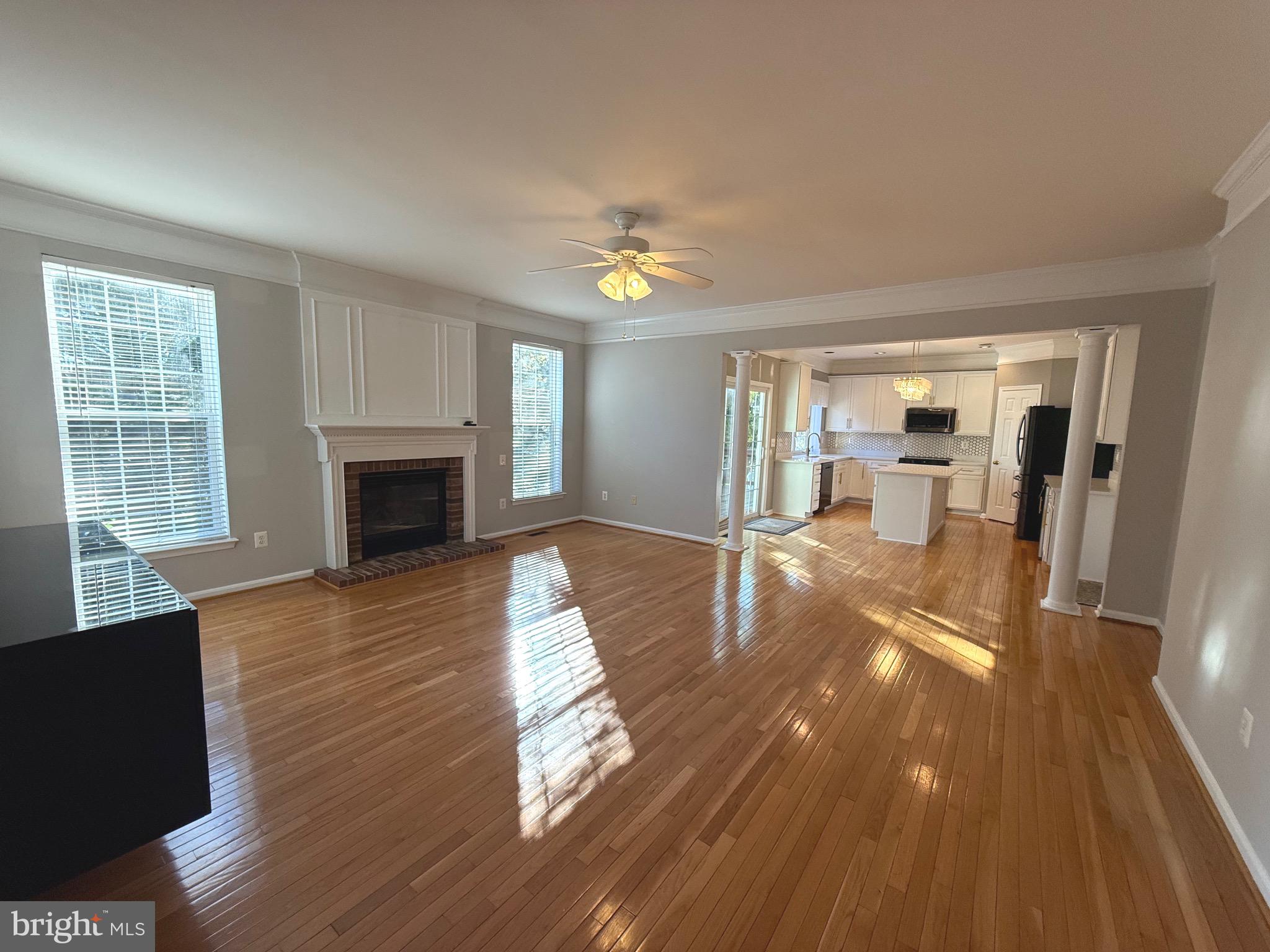 1743 Wheyfield Drive Frederick, MD 21701 - Photo 8 of 47 a living room with furniture and a fireplace
