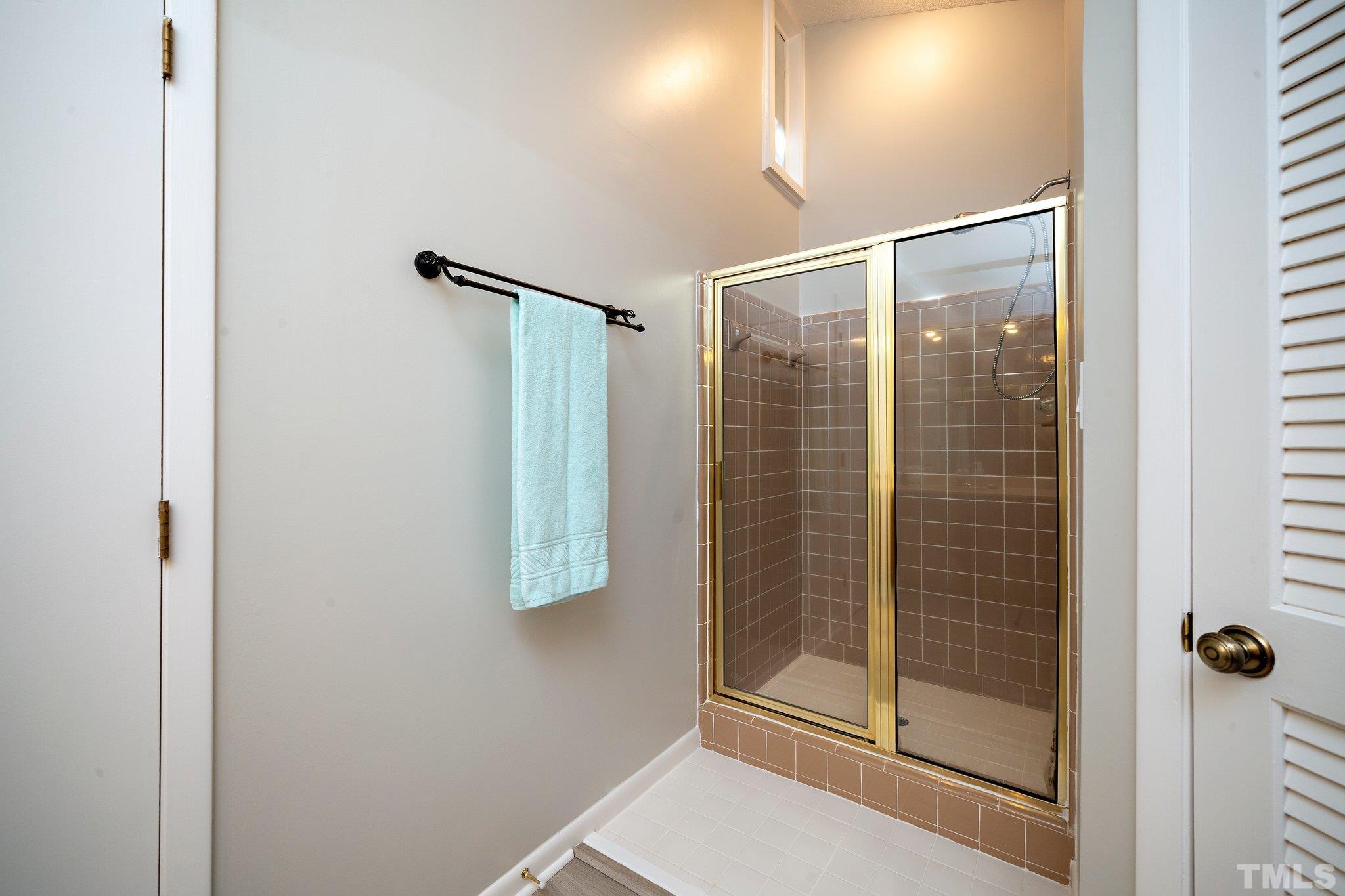 4353 Southwind Drive Raleigh, NC 27613 - Photo 17 of 23 a bathroom with a shower