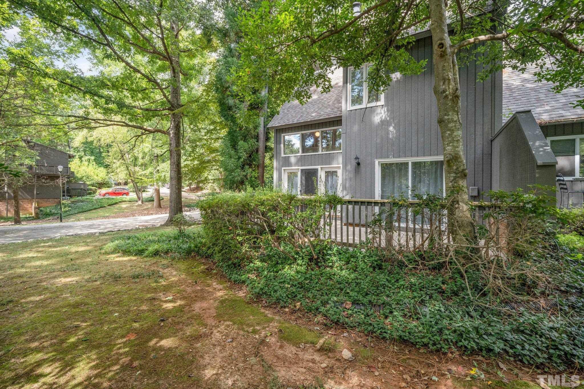 4353 Southwind Drive Raleigh, NC 27613 - Photo 23 of 23 a front view of a house with a yard