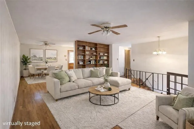 a view of livingroom with hardwood floor and a ceiling fan