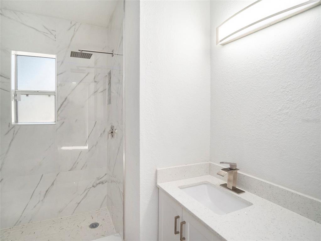 5136 Colbert Road Lakeland, FL 33812 - Photo 13 of 28 a bathroom with a sink and a mirror