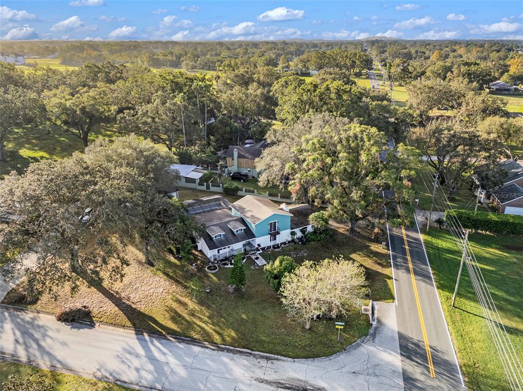 5136 Colbert Road Lakeland, FL 33812 - Photo 28 of 28 an aerial view of residential houses with outdoor space and trees