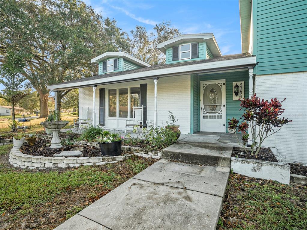 5136 Colbert Road Lakeland, FL 33812 - Photo 3 of 28 a front view of a house with a yard