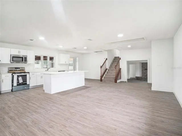 a view of a kitchen with furniture and a kitchen