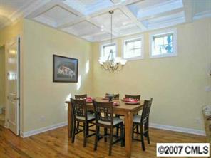 4252 Castleton Road Charlotte, NC 28211 - Photo 4 of 8 a view of a dining room with furniture and chandelier