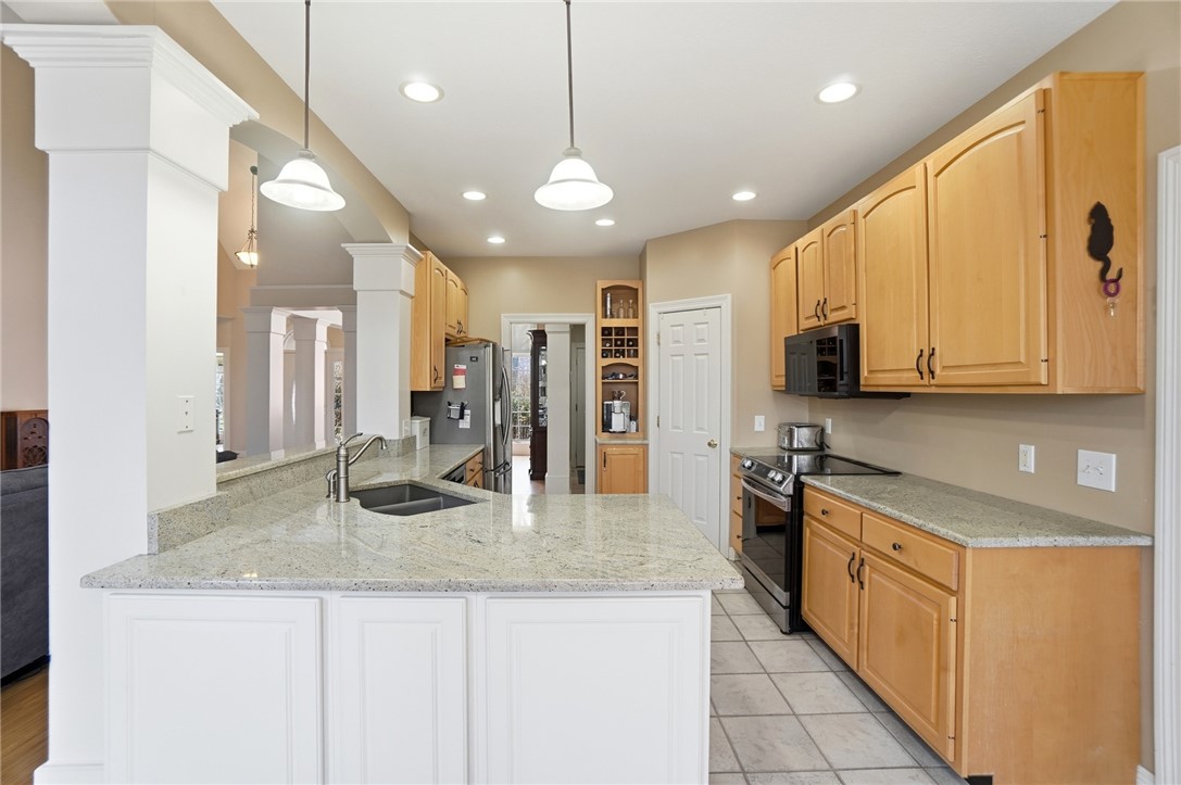 472 Timber Walk Court Springboro, OH 45066 - Photo 9 of 86 This spacious kitchen offers ample counter space and natural light, perfect for culinary endeavors.