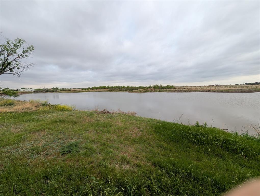 613 North Access Road Merkel, TX 79536 - Photo 1 of 11 a view of a lake with a big yard